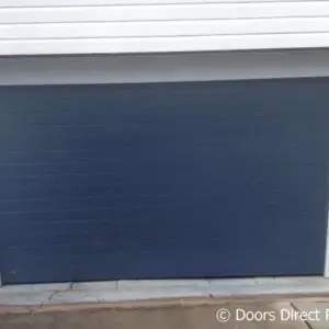 Contemporary Tilt door, Deep Ocean with side flashing covers in Surfmist white 2