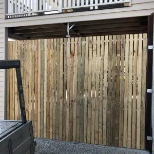 Tilt Door with raw timber battens